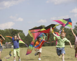 Kids flying kites for wind activity