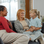 Mom and nanny discussing ways to prevent burnout