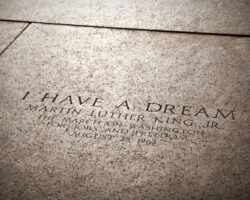 Dr. Martin Luther King Jr.’s ‘I Have a Dream’ quote engraved in stone, reflecting values taught to children on MLK Day.