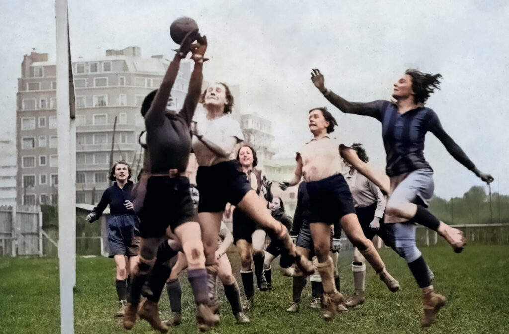 Nettie Nettie Honeyball in action with other female soccer players.