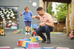 manny with child on playground